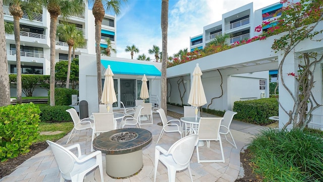 view of patio with a fire pit