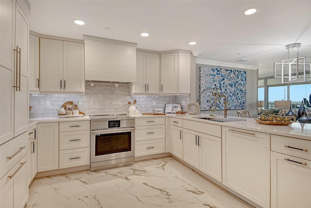 2105 Gulf Of Mexico Dr Unit 3303, Longboat Key, FL 34228 - kitchen with stove, custom range hood, light marble finish floors, light countertops, and decorative backsplash