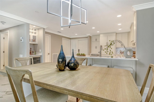 2105 Gulf Of Mexico Dr Unit 3303, Longboat Key, FL 34228 - dining room with beverage cooler, recessed lighting, and ornamental molding
