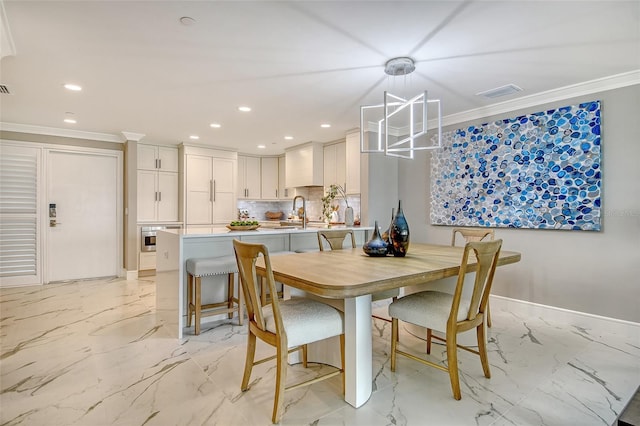 2105 Gulf Of Mexico Dr Unit 3303, Longboat Key, FL 34228 - dining area with light marble finish floors, ornamental molding, and recessed lighting