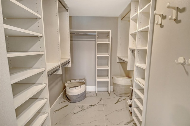 2105 Gulf Of Mexico Dr Unit 3303, Longboat Key, FL 34228 - spacious closet with marble look tile flooring