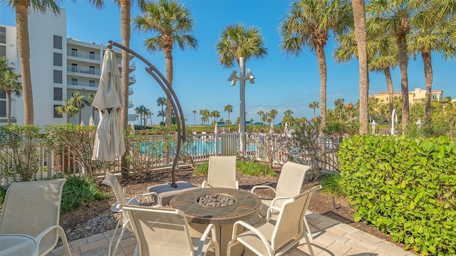 2105 Gulf Of Mexico Dr Unit 3303, Longboat Key, FL 34228 - view of patio featuring a fire pit
