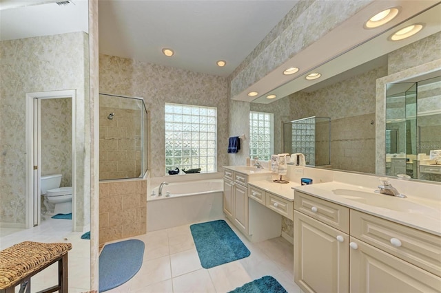 full bathroom with tile patterned floors, vanity, toilet, and shower with separate bathtub