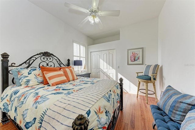 bedroom featuring ceiling fan, a closet, and wood-type flooring