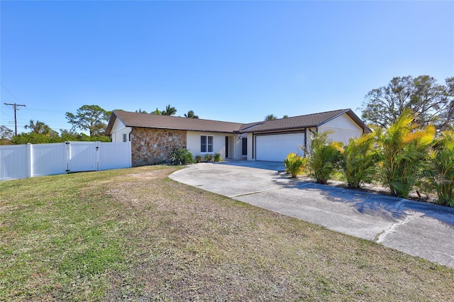 view of front of home featuring a garage and a front lawn