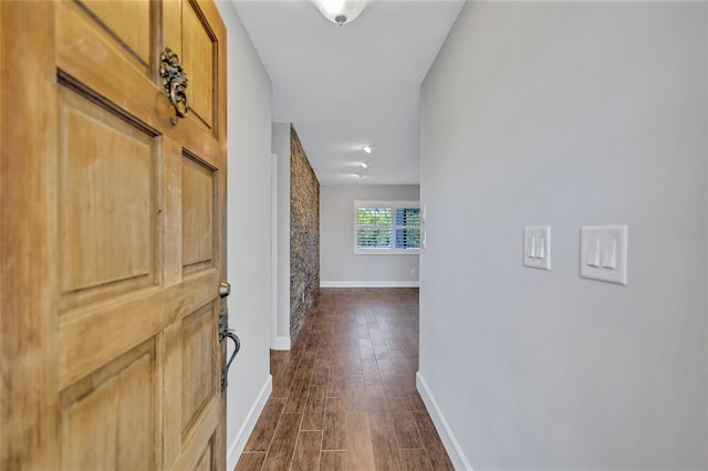 hallway with dark hardwood / wood-style floors