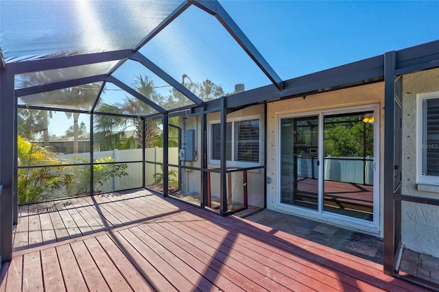 unfurnished sunroom with lofted ceiling