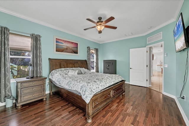 bedroom with dark hardwood / wood-style flooring, ceiling fan, and crown molding