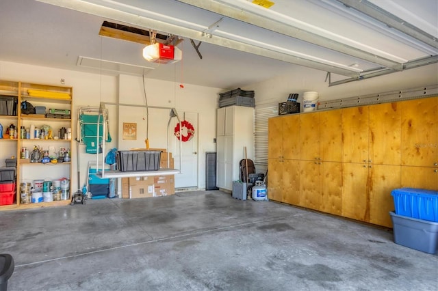 garage featuring a garage door opener