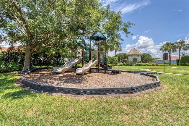 view of jungle gym with a lawn