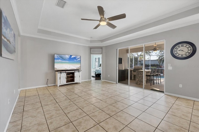 unfurnished living room featuring visible vents, baseboards, ceiling fan, ornamental molding, and a tray ceiling