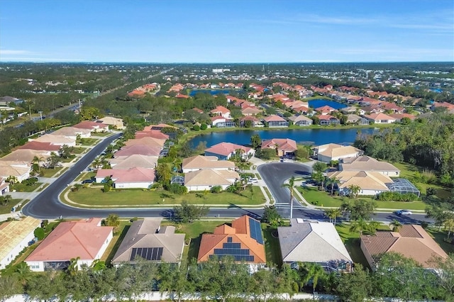 birds eye view of property with a water view and a residential view