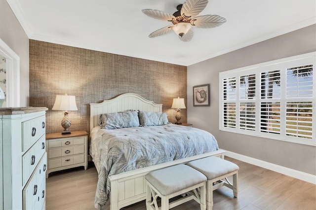 11265 Mc Dermott Ct, Englewood, FL 34223 - bedroom with light wood-type flooring, an accent wall, and ceiling fan