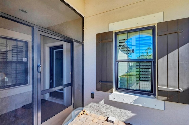 11265 Mc Dermott Ct, Englewood, FL 34223 - property entrance with stucco siding