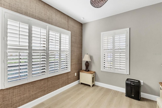 11265 Mc Dermott Ct, Englewood, FL 34223 - empty room with light wood-style flooring and baseboards