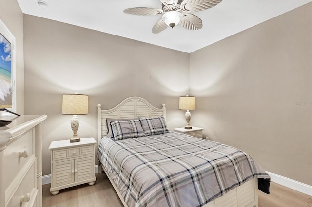 bedroom featuring ceiling fan and light hardwood / wood-style floors