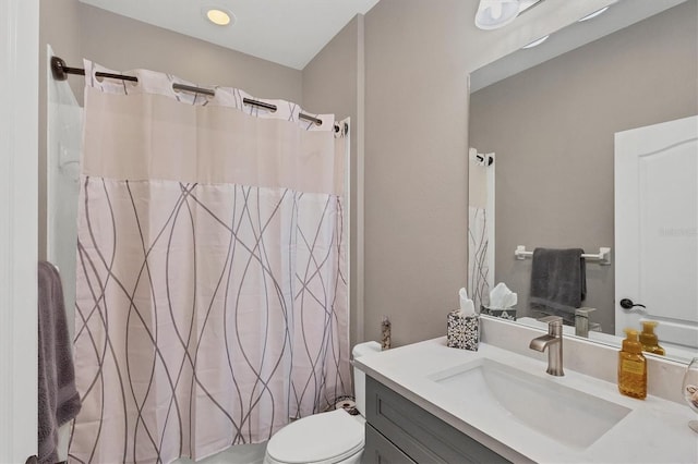 bathroom featuring vanity and toilet