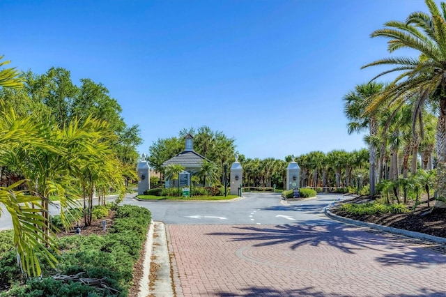 11265 Mc Dermott Ct, Englewood, FL 34223 - view of decorative road with curbs and a gated entry
