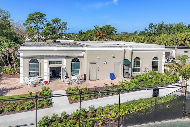 11265 Mc Dermott Ct, Englewood, FL 34223 - view of front of property featuring stucco siding and a patio area