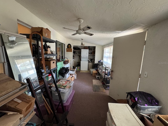 miscellaneous room featuring carpet flooring, ceiling fan, a textured ceiling, and lofted ceiling