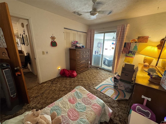 carpeted bedroom with access to exterior, ceiling fan, a closet, and a textured ceiling