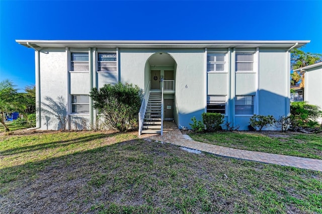 view of front of home with a front yard