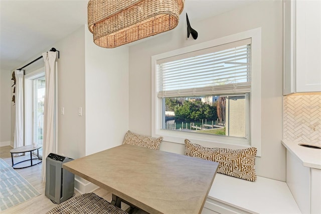 dining area featuring breakfast area and light wood-type flooring