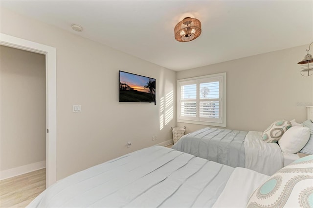 bedroom with light hardwood / wood-style floors