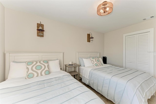 bedroom featuring a closet and hardwood / wood-style floors