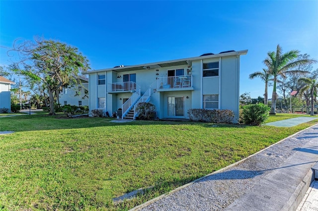 view of front of property with a front lawn