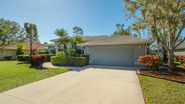 ranch-style home featuring a garage and a front lawn