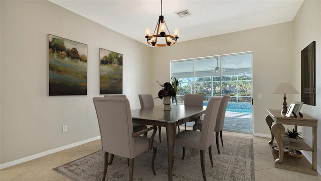 dining space with an inviting chandelier and light tile patterned floors