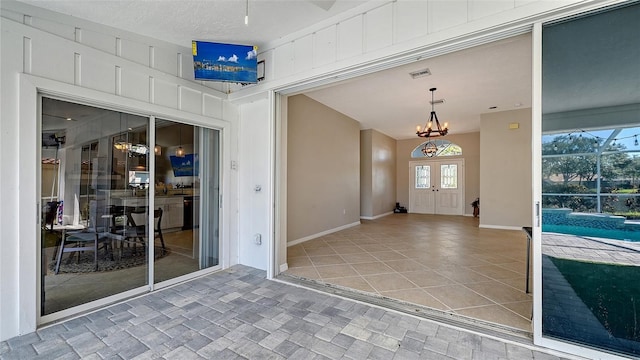 entrance to property featuring a patio area