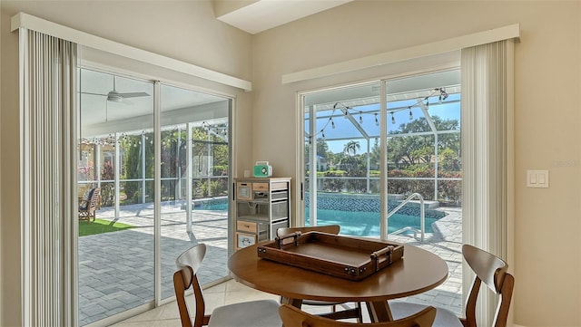 entryway with ceiling fan and light tile patterned floors