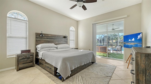 bedroom featuring ceiling fan, access to exterior, light tile patterned floors, and lofted ceiling