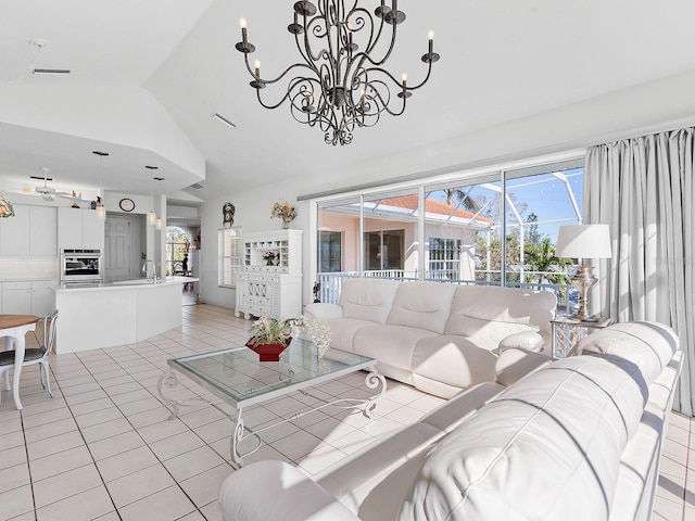 tiled living room featuring a chandelier, high vaulted ceiling, and sink