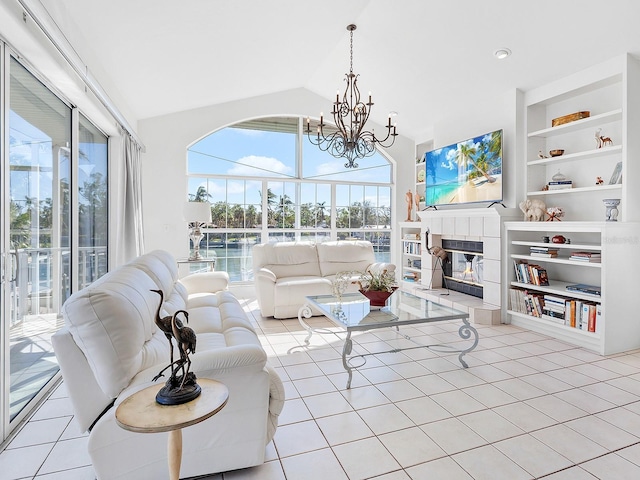 tiled living room featuring a fireplace, lofted ceiling, and an inviting chandelier