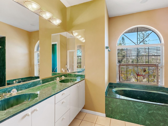 508 Siesta Dr, Sarasota, FL 34242 - bathroom with tile patterned flooring, a garden tub, and double vanity