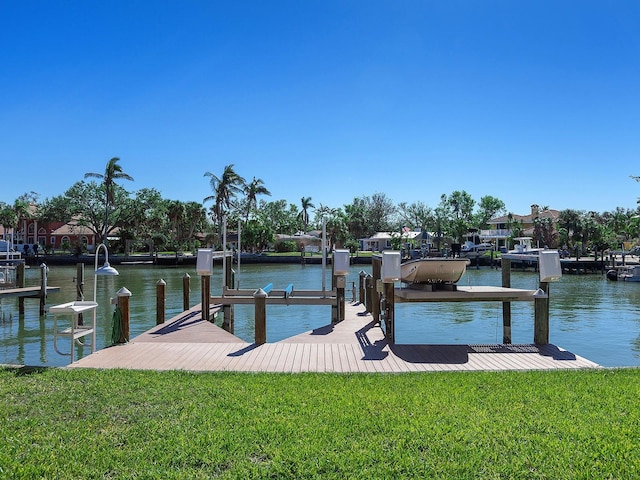 508 Siesta Dr, Sarasota, FL 34242 - dock featuring boat lift, a lawn, and a water view