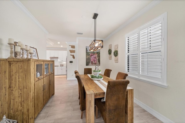 dining area with crown molding