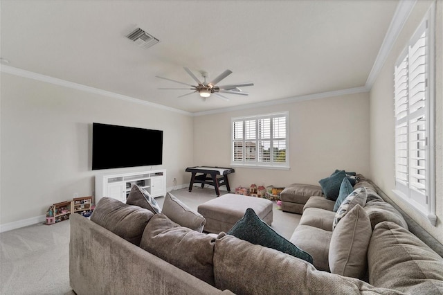 carpeted living room featuring ceiling fan and crown molding