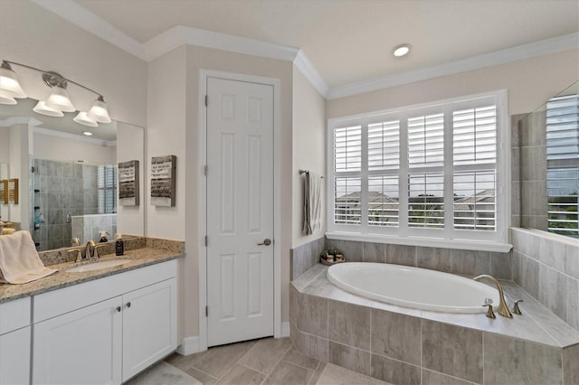 bathroom with vanity, independent shower and bath, and ornamental molding