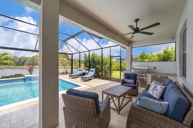 view of patio / terrace with an outdoor living space, grilling area, an outdoor kitchen, a water view, and a lanai