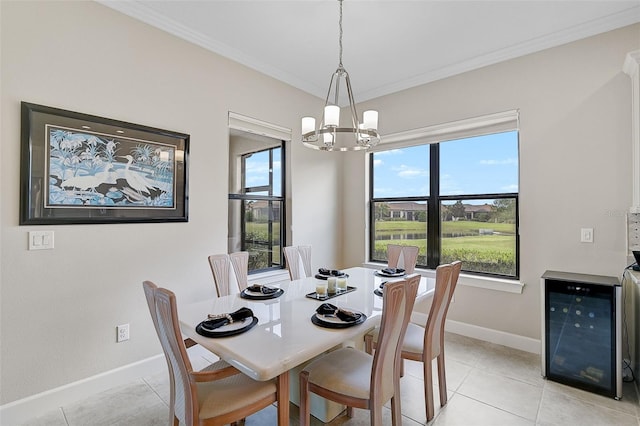 tiled dining space with plenty of natural light, beverage cooler, a chandelier, and ornamental molding