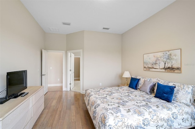 bedroom with light hardwood / wood-style floors