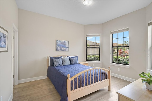 bedroom with light hardwood / wood-style floors