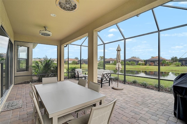 sunroom with a water view