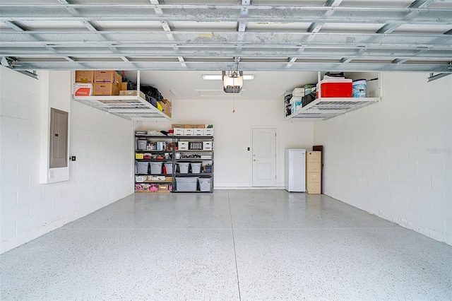 garage featuring electric panel and a garage door opener