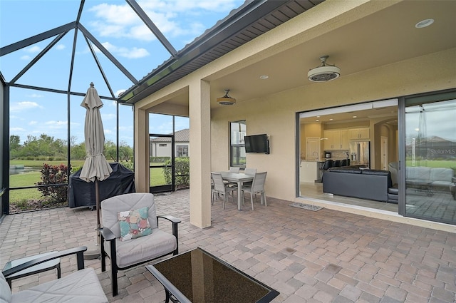 view of patio with a lanai