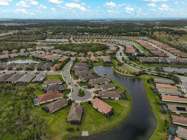 bird's eye view with a water view